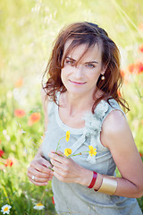 Image showing adult brunette woman smiling in summertime outdoor