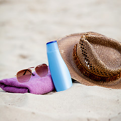 Image showing sunprotection objects on the beach in holiday