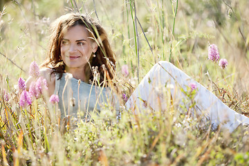 Image showing adult brunette woman smiling in summertime outdoor