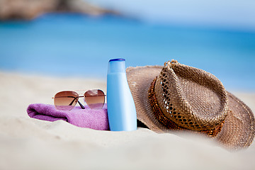 Image showing sunprotection objects on the beach in holiday