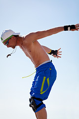 Image showing young man with inline skates in summer outdoor 