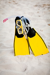 Image showing yellow fins and snorkelling mask on beach in summer