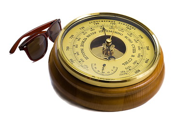 Image showing Barometer - aneroid on a white background and black sunglasses