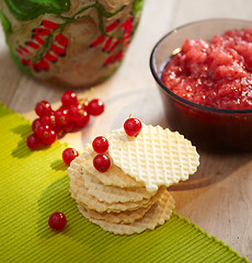 Image showing freshly baked waffles and red berry jam