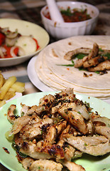 Image showing Mexican food with tortillas and nachos 