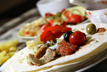 Image showing Mexican food with tortillas and nachos 	