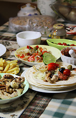 Image showing Mexican food with tortillas and nachos 	