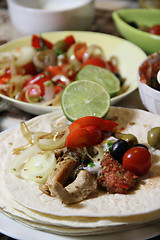 Image showing Mexican food with tortillas and nachos 	