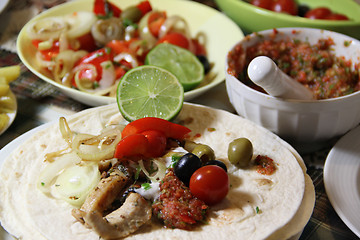 Image showing Mexican food with tortillas and nachos 	