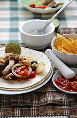 Image showing Mexican food with tortillas and nachos 	