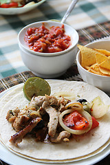 Image showing Mexican food with tortillas and nachos 