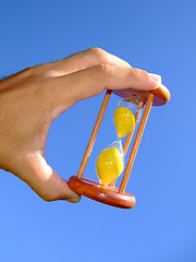 Image showing Holding a sand-glass