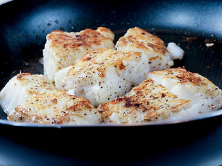 Image showing Frying fish, white fish