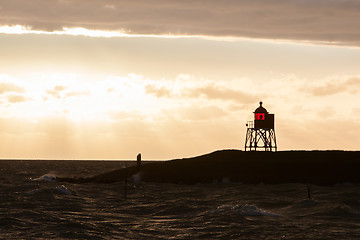 Image showing Silhouette of a red beacon at the dutch coast