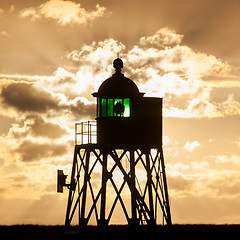 Image showing Silhouette of a green beacon at the dutch coast