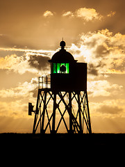 Image showing Silhouette of a green beacon at the dutch coast