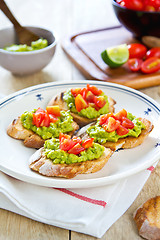 Image showing Crostini with avocado and tomato
