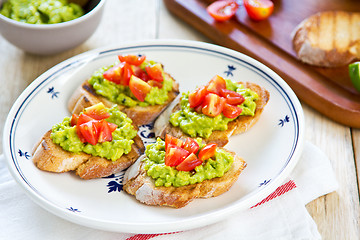 Image showing Crostini with avocado and tomato