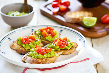 Image showing Crostini with avocado and tomato
