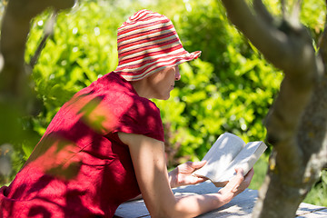 Image showing Mature woman reading book
