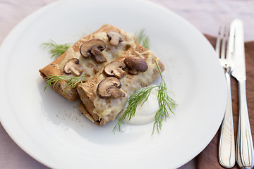 Image showing Tasty salty pancakes with mushrooms