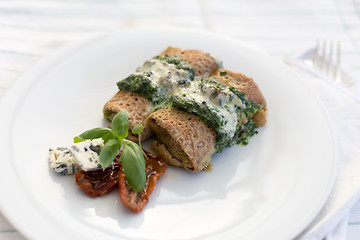 Image showing Delicious salty pancakes with spinach