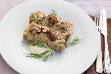 Image showing Delicious salty pancakes with mushrooms
