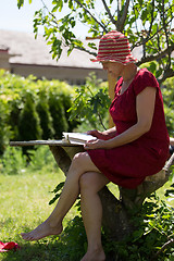 Image showing Senior woman reading book