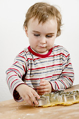 Image showing young child making cookies