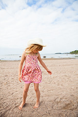 Image showing Young barefoot girl at beach