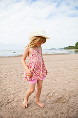 Image showing Young barefoot girl at beach