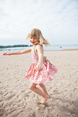 Image showing Smiling young girl having fun at beach