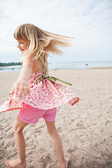 Image showing Smiling young girl having fun at beach