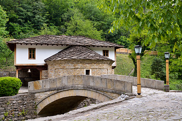 Image showing Old house and a stone bridge in the architectural complex Etara,