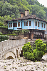 Image showing Old house and a stone bridge in the architectural complex Etara,