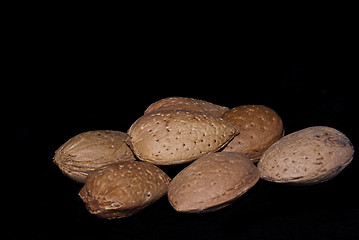 Image showing almonds isolated on a black