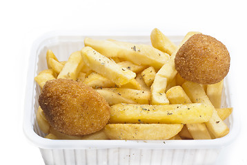 Image showing close up of basket of fries and arancini