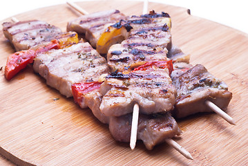 Image showing mixed meat skewer on wooden