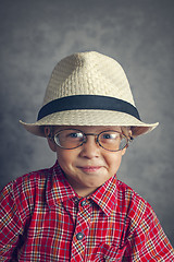 Image showing boy in a cap and glasses