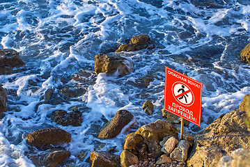 Image showing Danger! No walking sign on the rocky sea coast