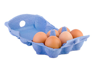 Image showing Cardboard egg box with six brown eggs