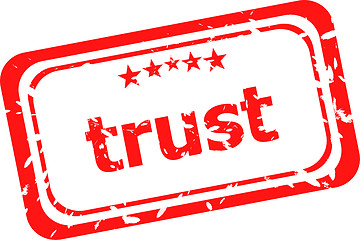 Image showing trust red rubber stamp over a white background