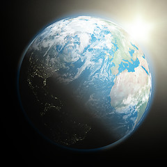 Image showing Sun rising over Earth