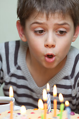 Image showing Cute boy at birthday cake