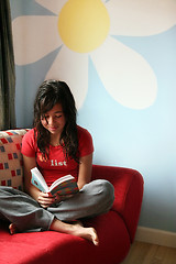 Image showing Girl reading at home