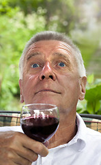 Image showing Happy senior enjoying drink