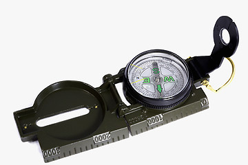 Image showing A small compass in a metal frame on a white background.