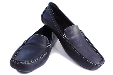 Image showing Black leather loafers on a white background.