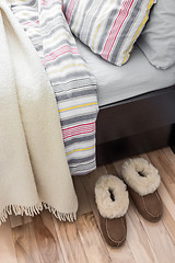 Image showing Cozy slippers near bed