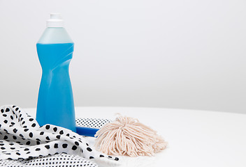 Image showing Dishwashing liquid, dishtowels and brush